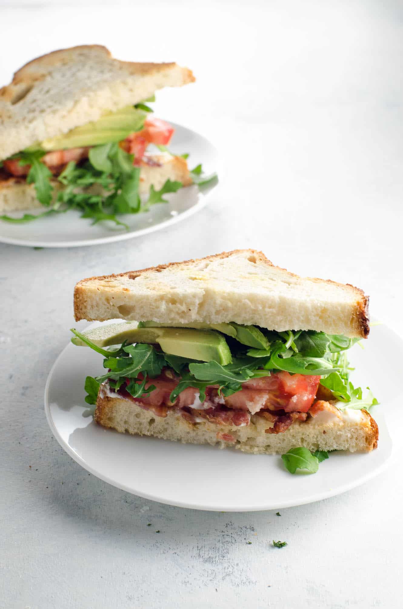 A BLAT sandwich divided between two plates