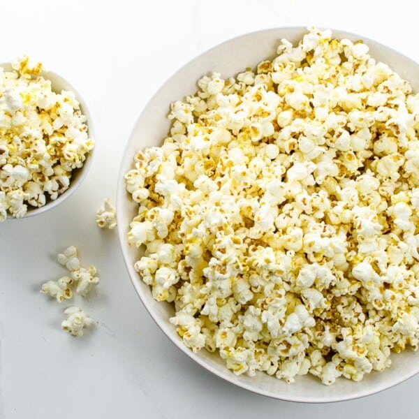 popcorn with nutritional yeast in white bowls