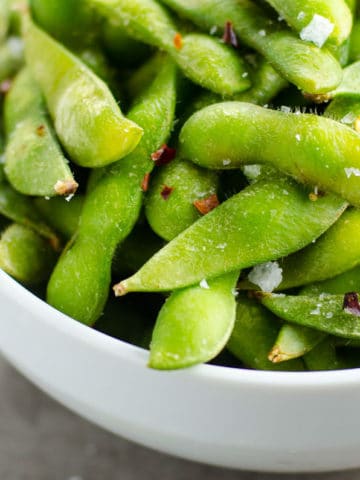 Wagamama-style chili salted edamame in a white bowl
