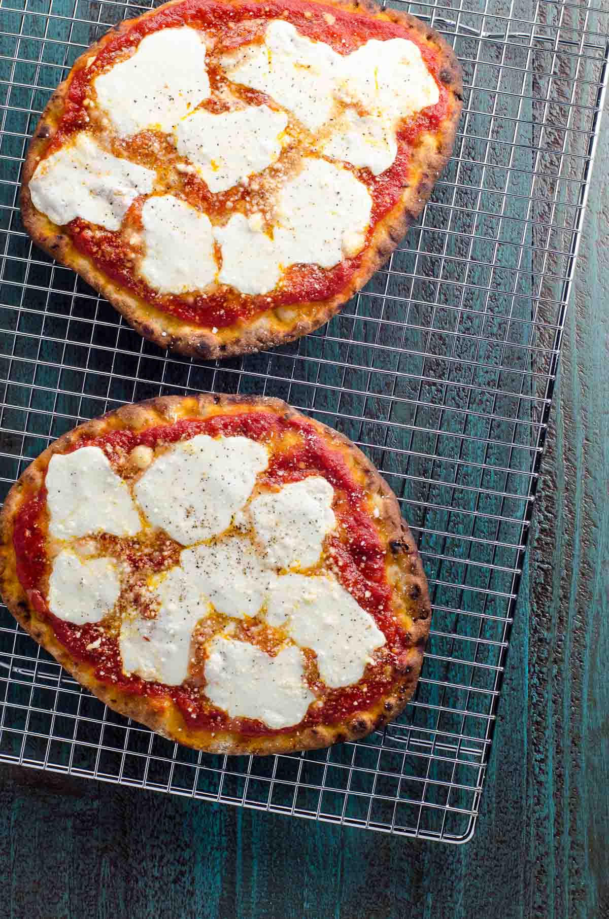 naan pizza on a cooling rack