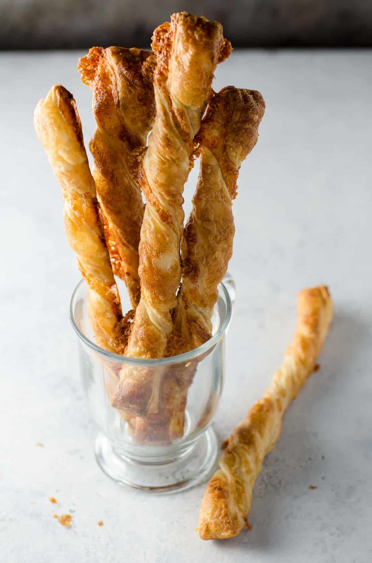 puff pastry cheese straws in a cup