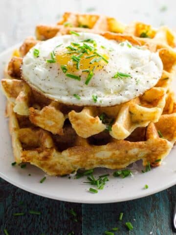 savory waffles with cheddar and chives with a fried egg on top