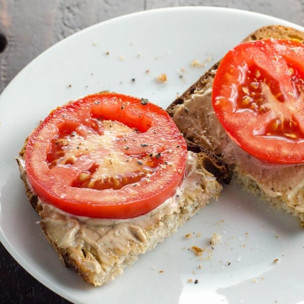 black garlic mayo on rye toast with tomato slices