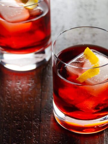 two glasses each containing a negroni italian aperitif