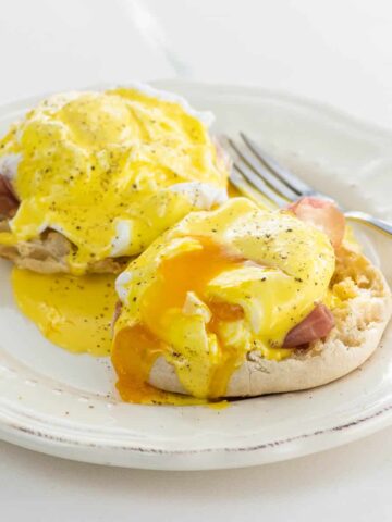 prosciutto eggs benedict with immersion blender hollandaise on a plate with a fork