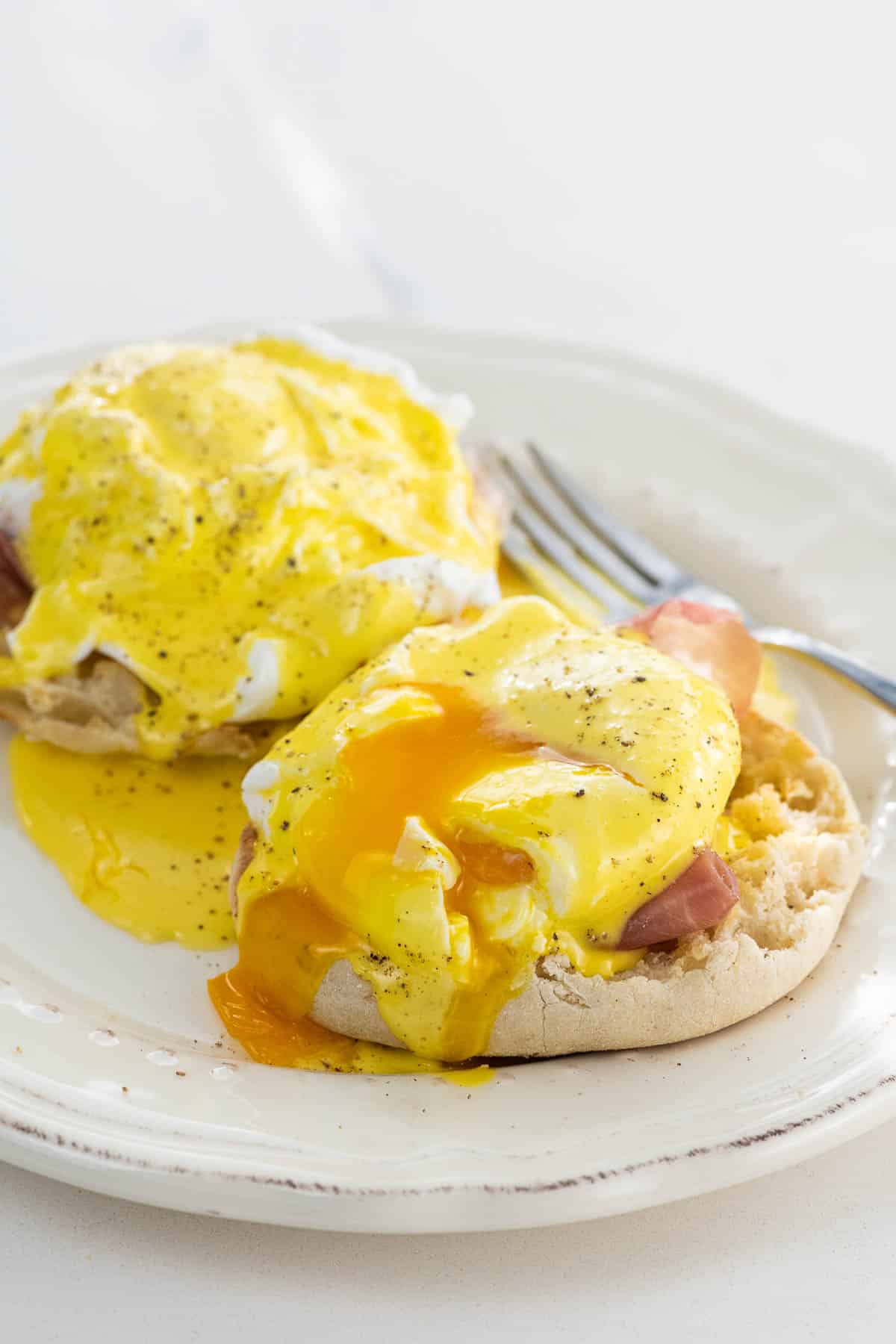 prosciutto eggs benedict with immersion blender hollandaise on a plate with a fork