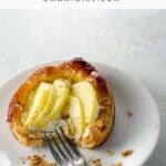 puff pastry apple tart with goat cheese and honey on a plate with a fork