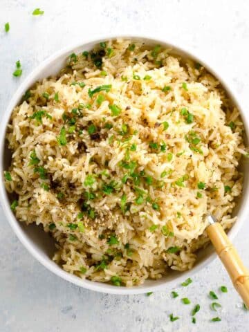 basmati rice pilaf in a bowl with a spoon