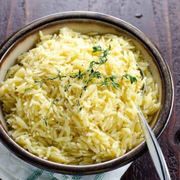 our favorite easy orzo recipe in a bowl with a spoon