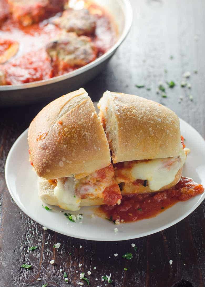 a baked turkey meatball sub and a pan of meatballs