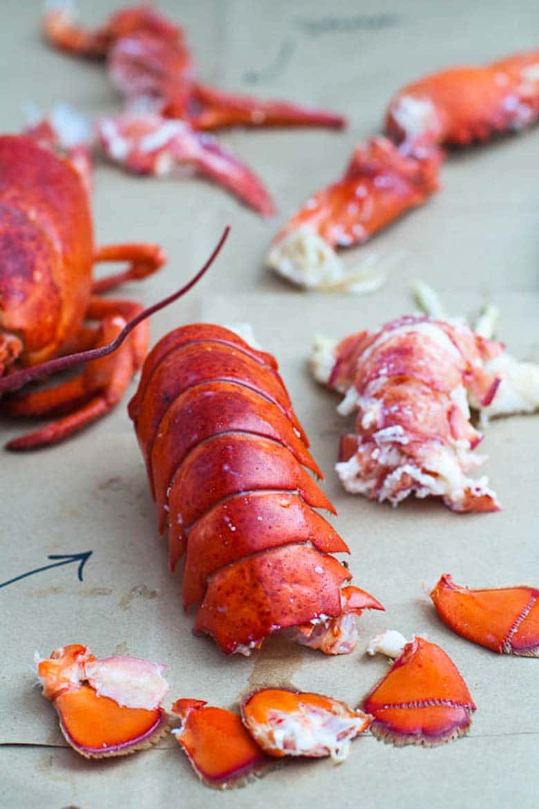 cooking live lobster and how to eat a whole lobster — tail parts and meat separated
