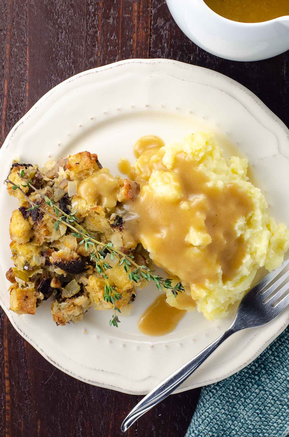 yukon gold mashed potatoes from a small batch on a plate with stuffing and gravy