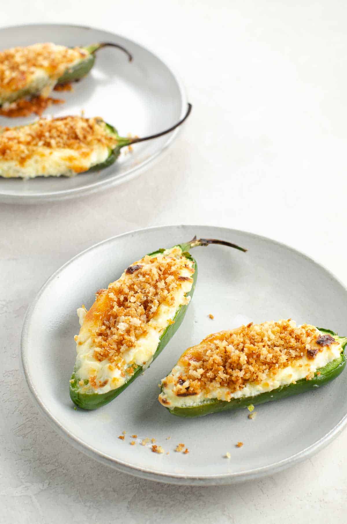 baked jalapeno poppers on plates