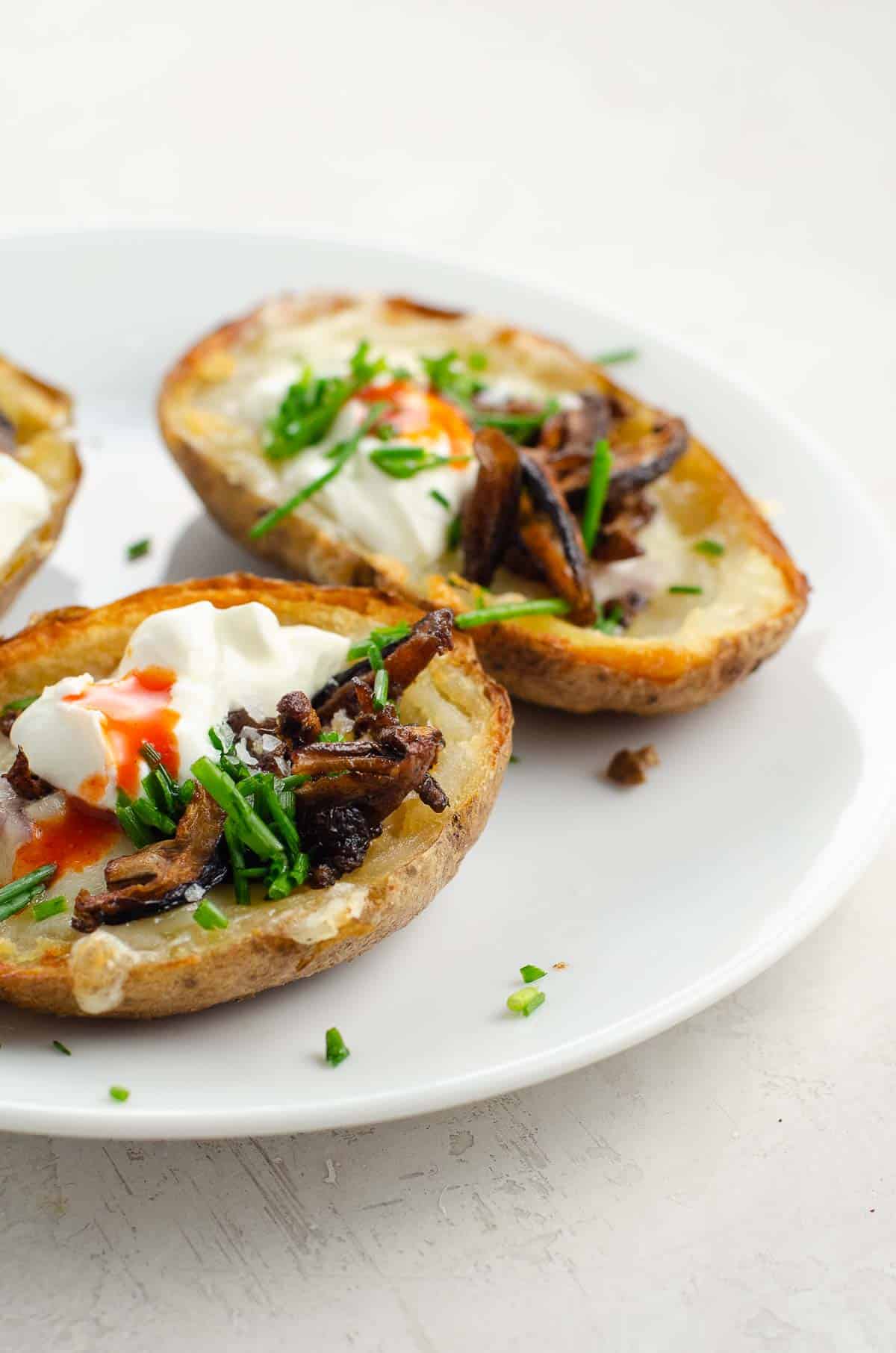 potato skins (TGIF and vegetarian versions) on a plate