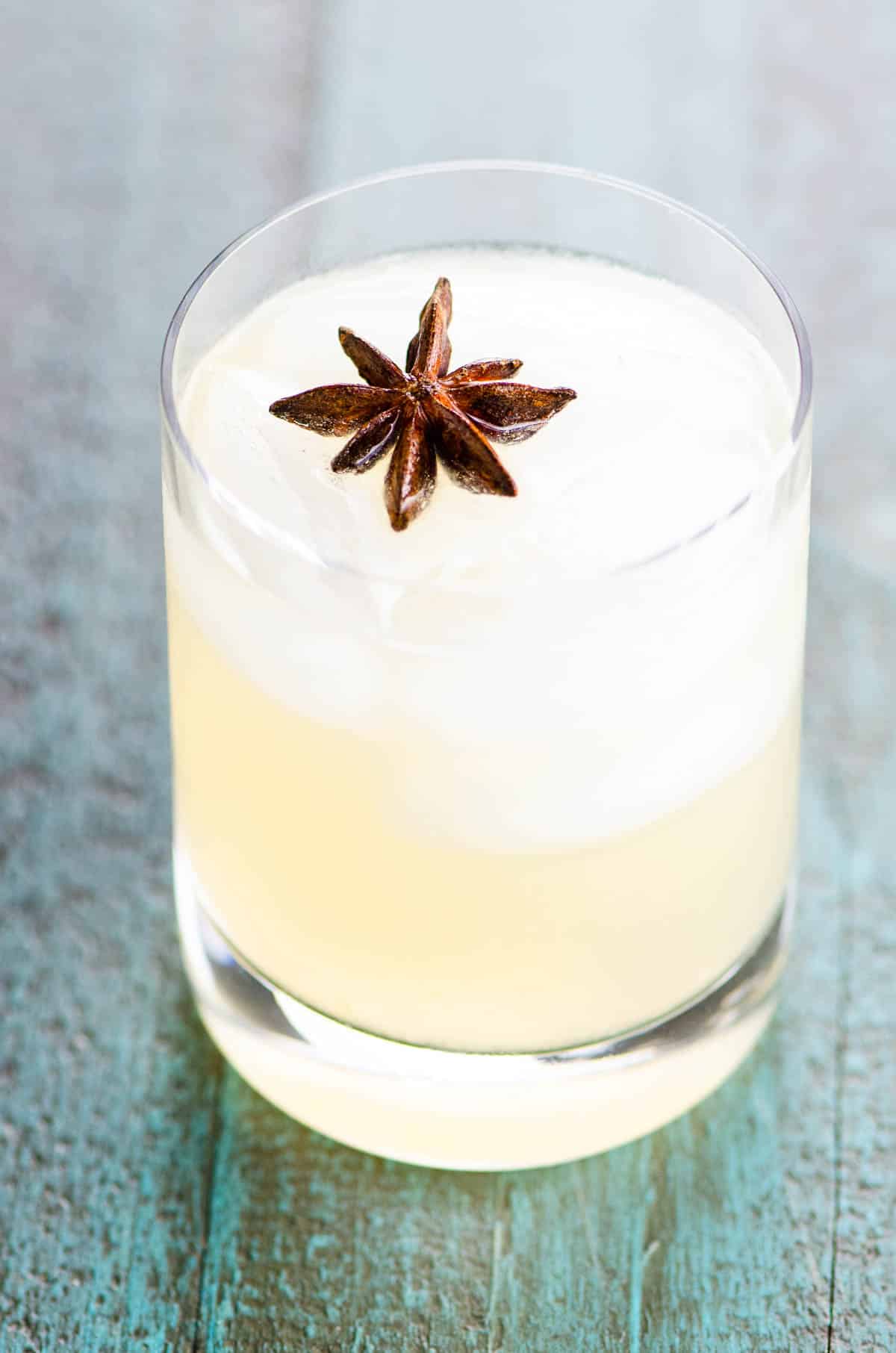 The Dreamcatcher blanco tequila cocktail with chartreuse in a rocks glass garnished with star anise