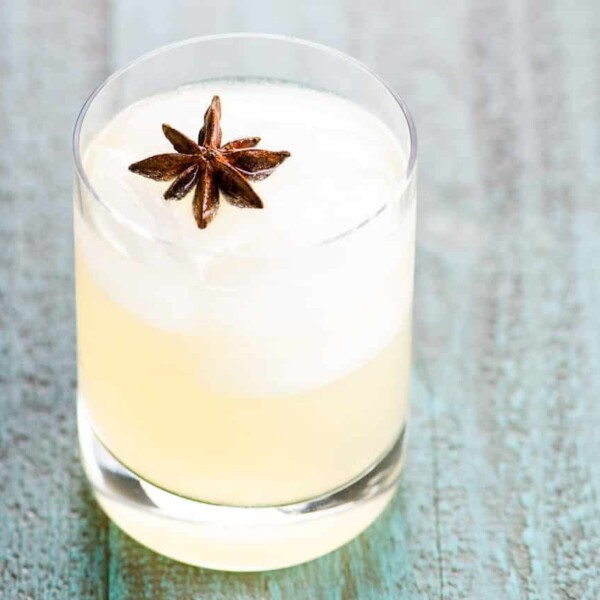 The Dreamcatcher blanco tequila cocktail with chartreuse in a rocks glass garnished with star anise