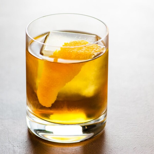 The Corduroy rye and cardamaro cocktail in a rocks glass garnished with an orange twist
