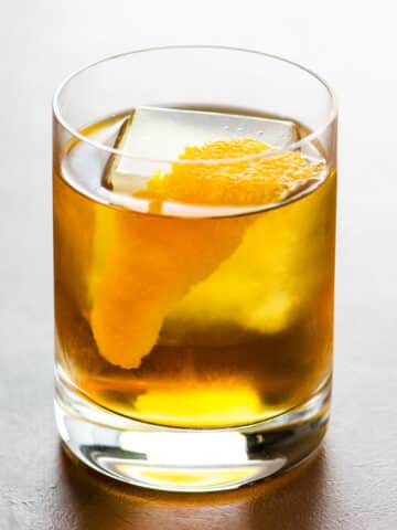 The Corduroy rye and cardamaro cocktail in a rocks glass garnished with an orange twist