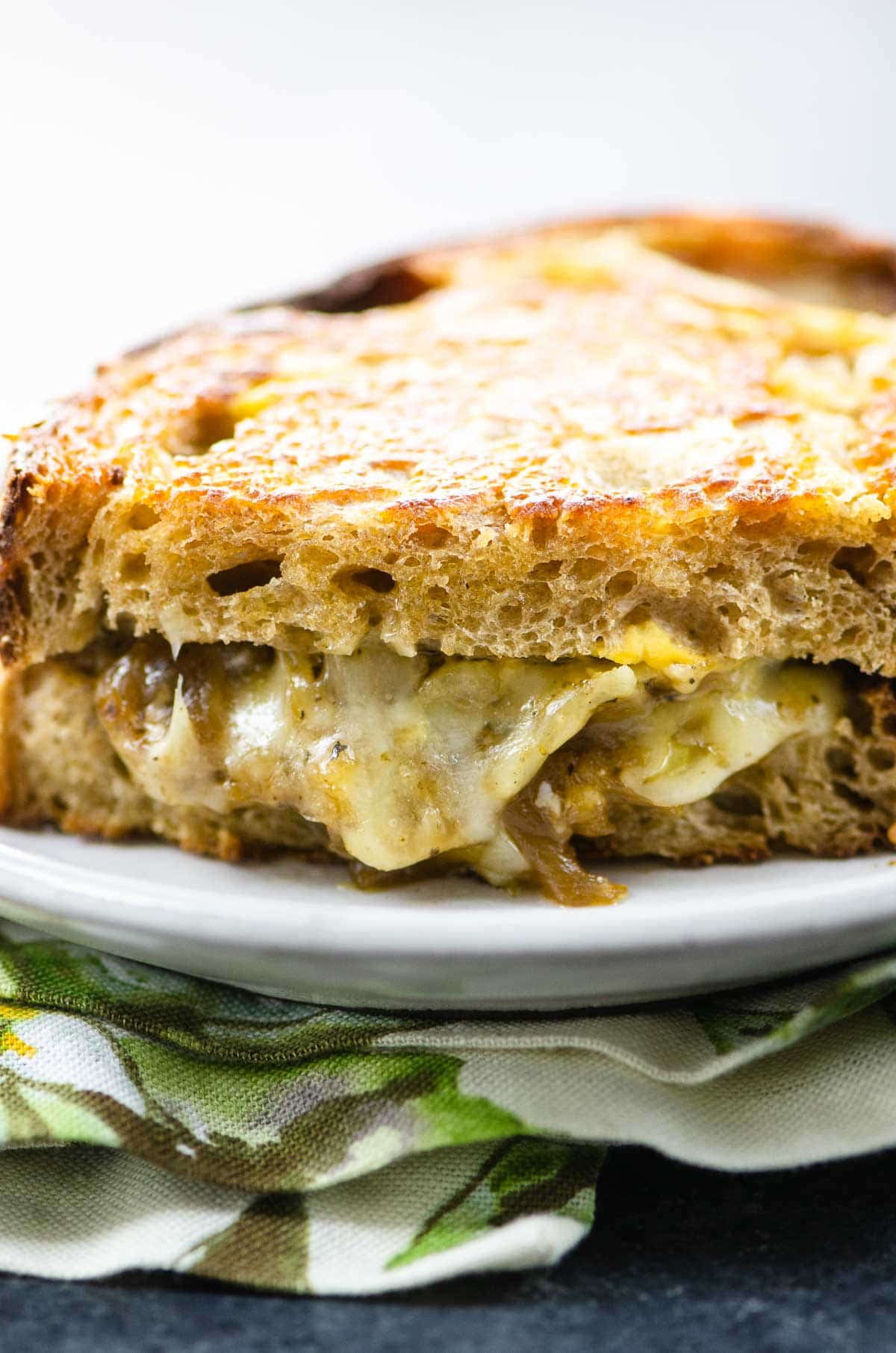 french onion grilled cheese on a plate with a napkin