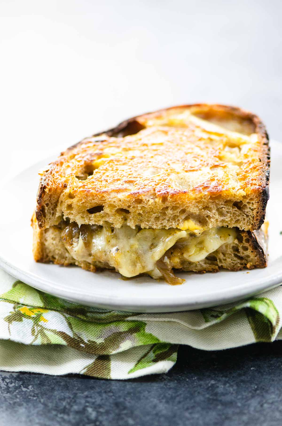 french onion grilled cheese on a plate with a napkin