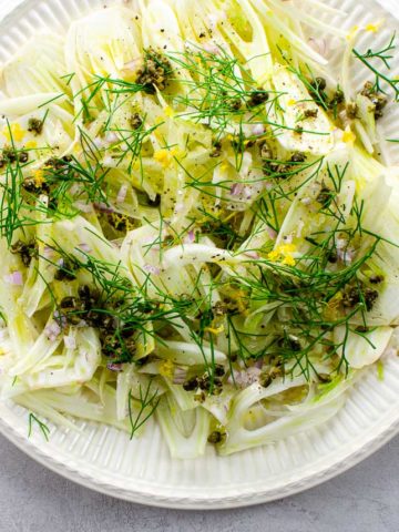 shaved fennel salad on an offwhite plate