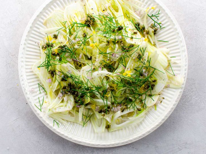 shaved fennel salad on an offwhite plate