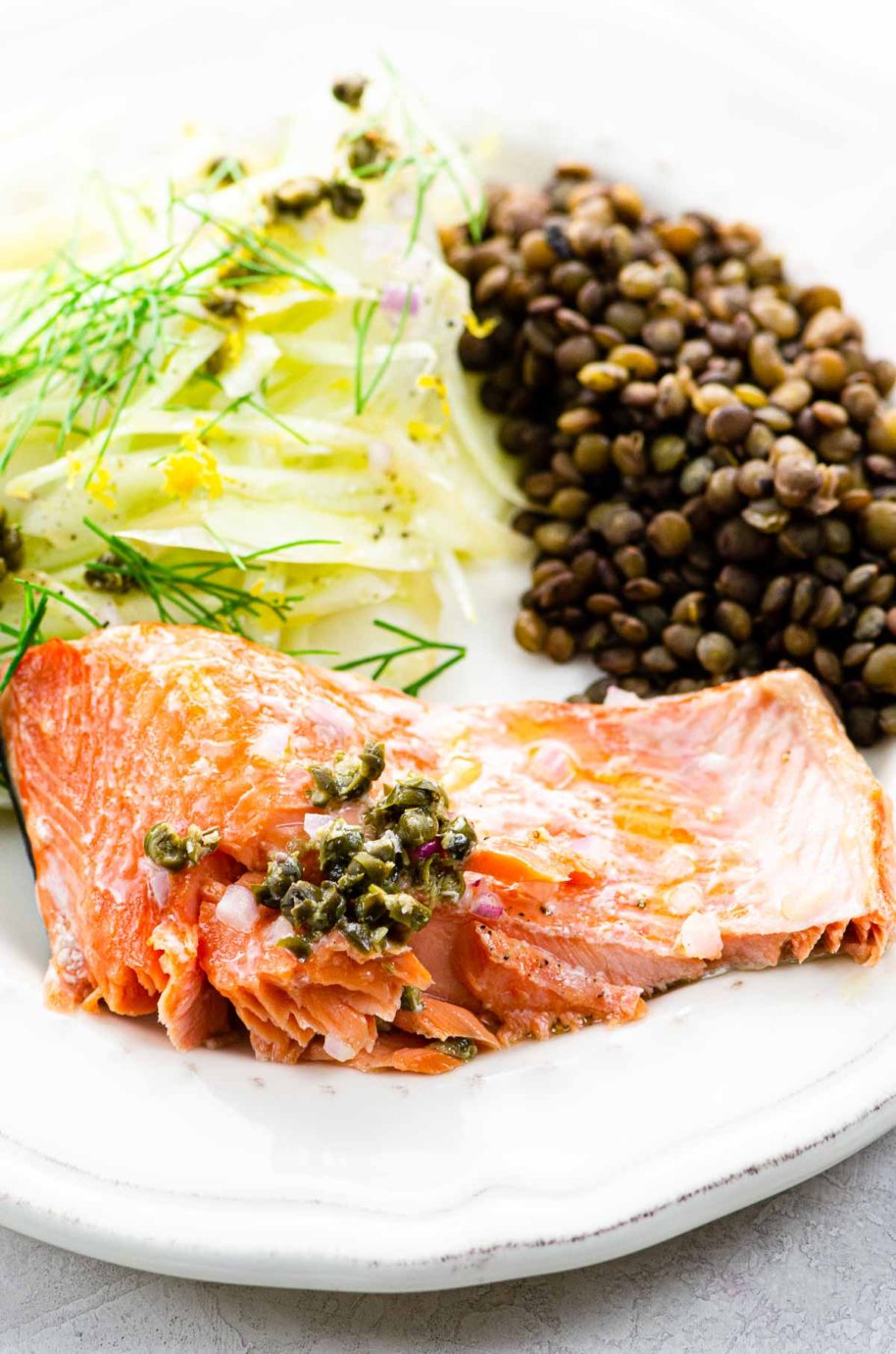 roasted salmon, lentils, and fennel salad on a plate