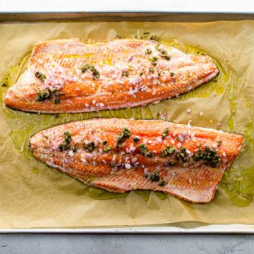 two slow roasted salmon fillets on a sheet pan