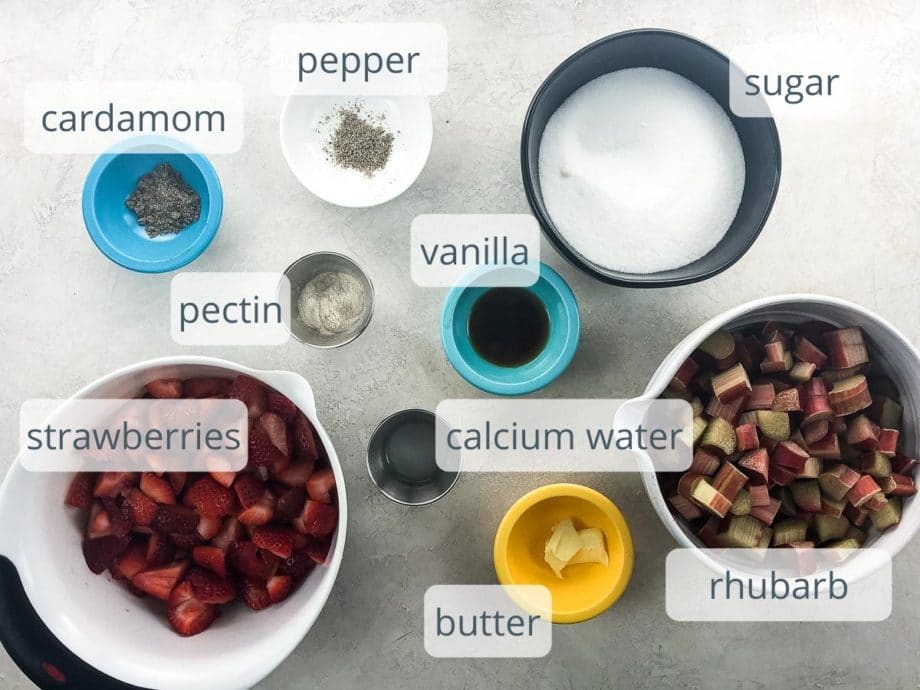 strawberries, rhubarb, sugar, and other ingredients in bowls