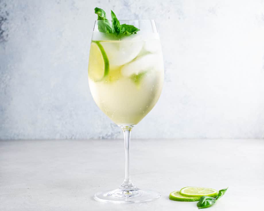 hugo spritz with basil and lime slices
