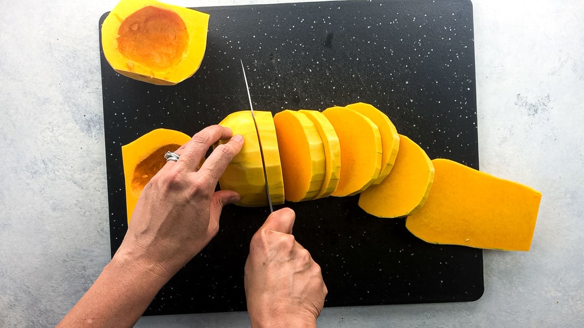 slicing butternut squash into rounds
