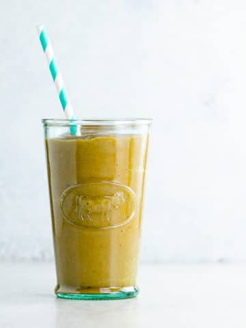 healthy pumpkin spice smoothie recipe in a glass with a straw