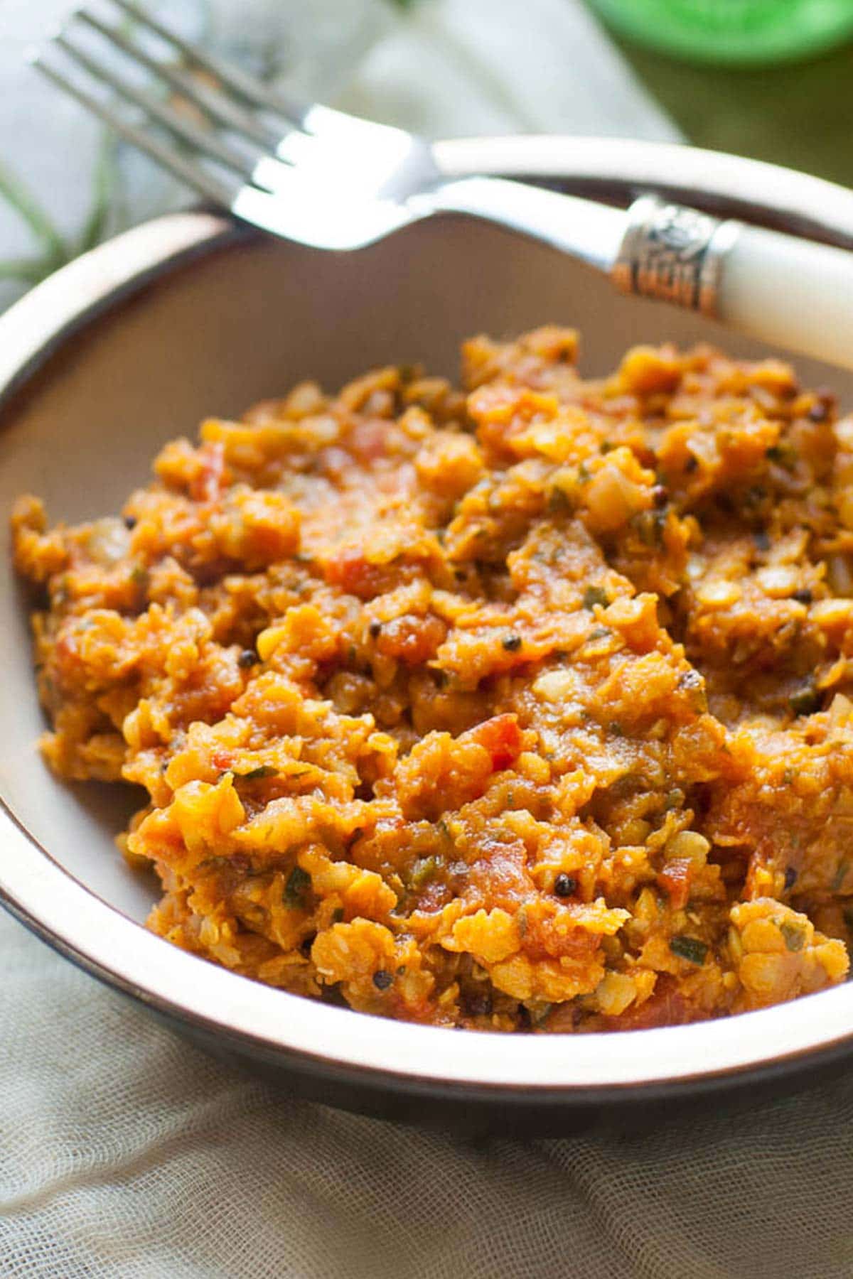 Cooked red lentils in a bowl