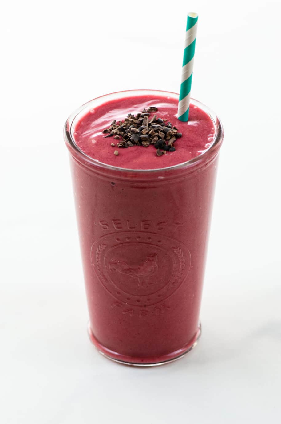 A raspberry and banana smoothie with cacao nibs