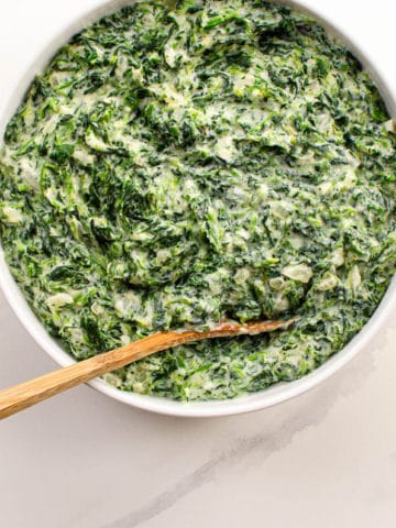 steakhouse creamed spinach in a white bowl