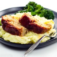 bbq meatloaf made with ground turkey with mashed potatoes and broccolini