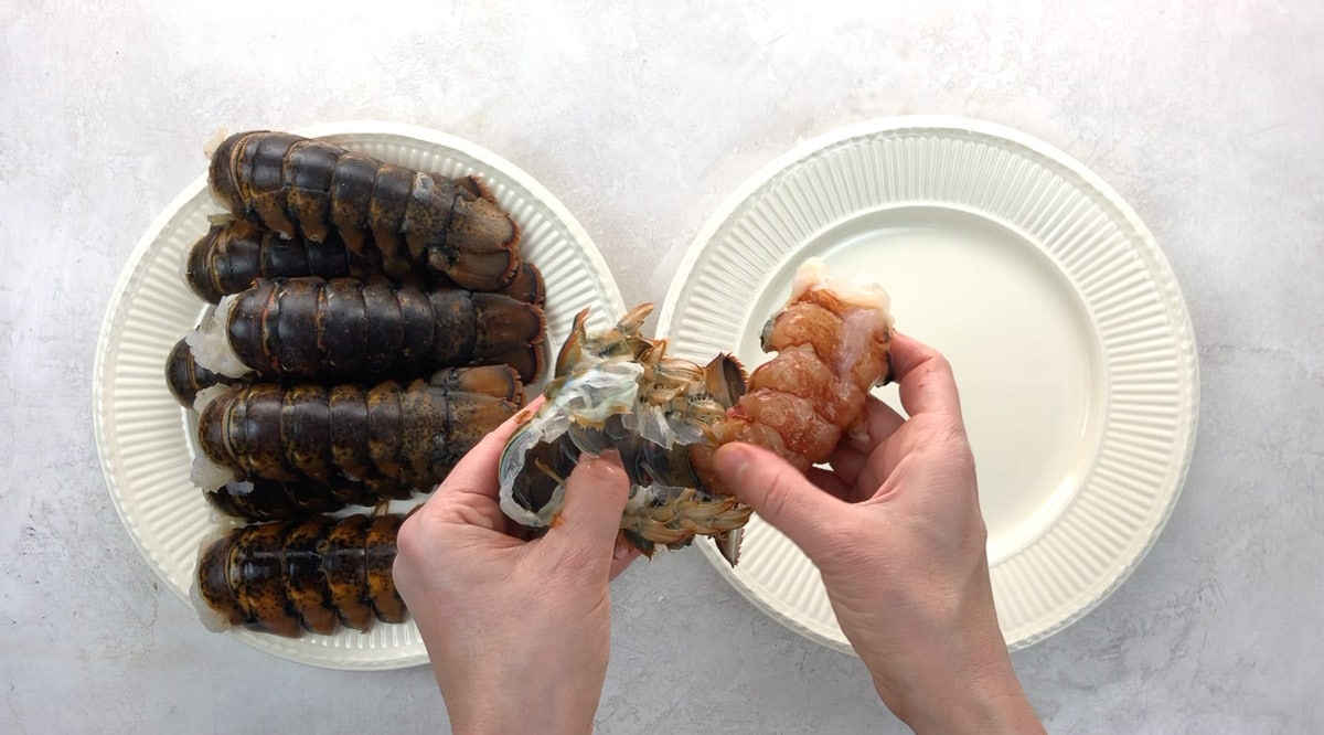 removing a lobster tail from the shell