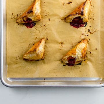 strawberry turnovers on a sheet pan