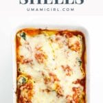 a baking pan of stuffed pasta shells with ricotta, spinach, and mushrooms