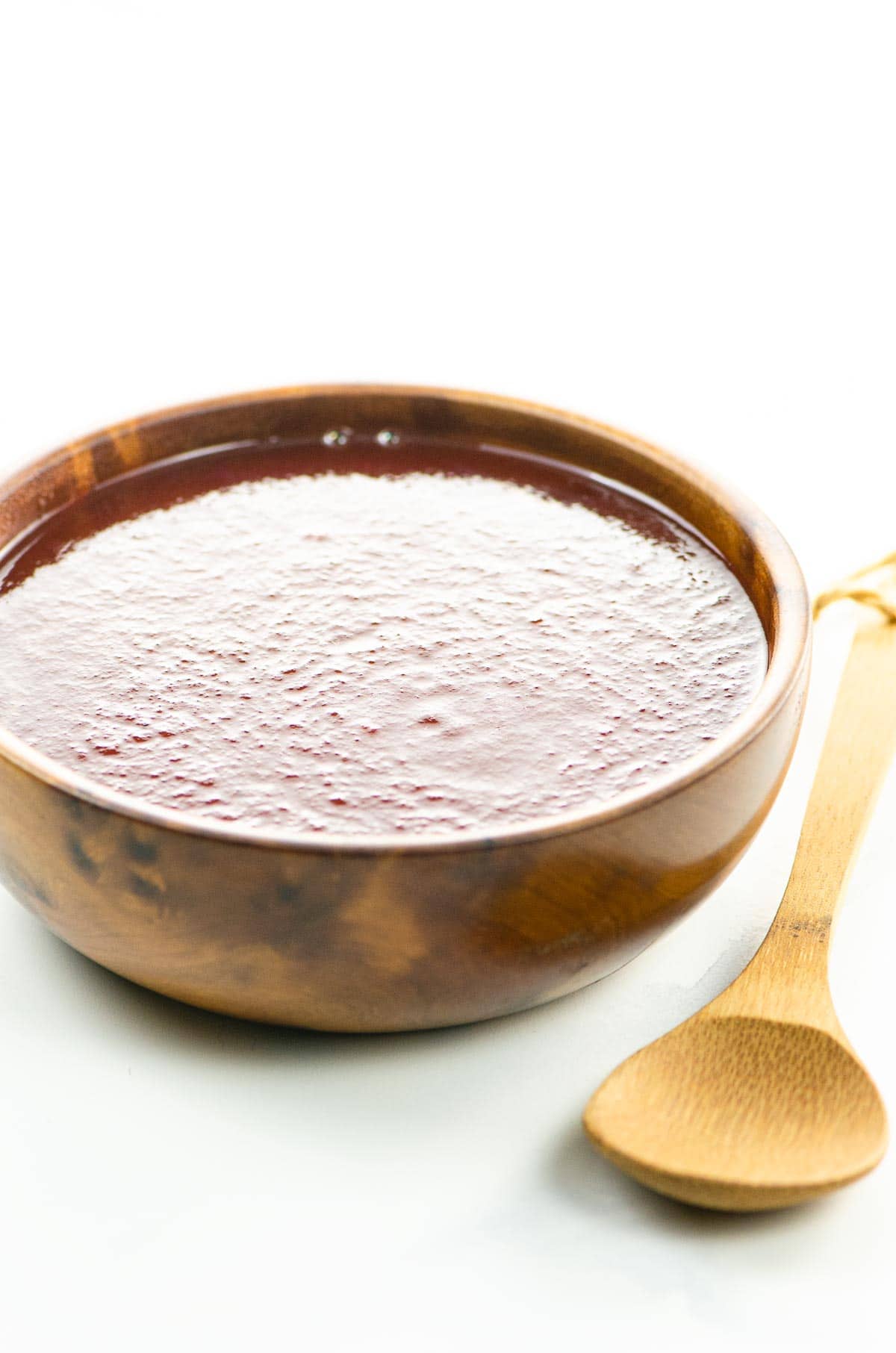 sweet and tangy bbq sauce in a bowl with a spoon