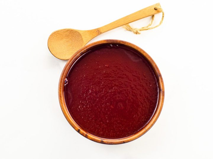 sweet and tangy bbq sauce in a bowl with a spoon