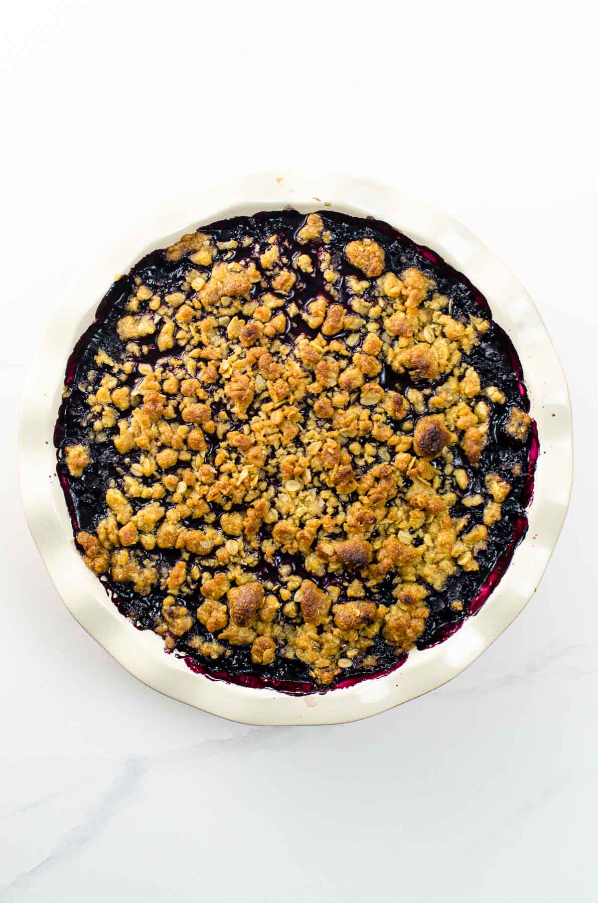 blueberry crisp in a deep dish pie plate