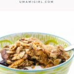 cinnamon granola with almonds, coconut, and dried cherries in a pretty bowl