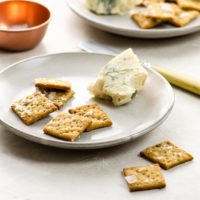 sourdough crackers and cheese on plates