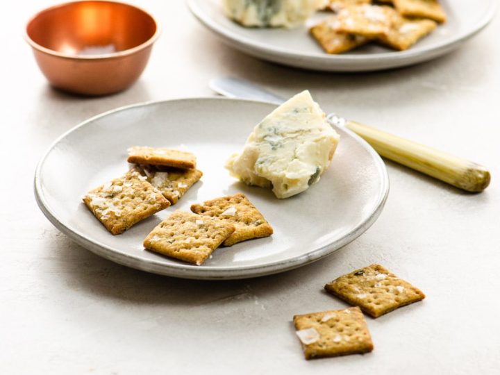 sourdough crackers and cheese on plates