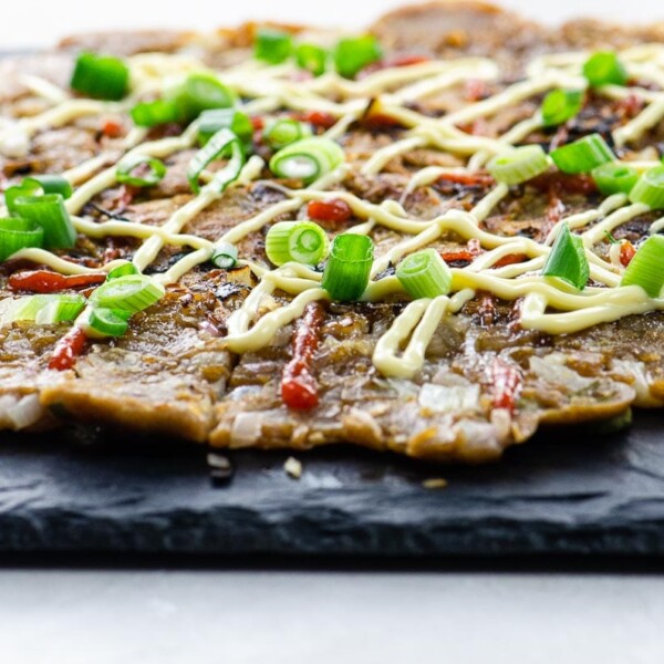 sourdough scallion pancakes with sriracha and japanese mayo on a slate