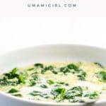 stracciatella alla romana (italian egg drop soup) in a white bowl