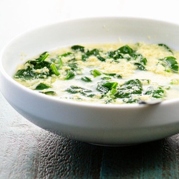 stracciatella alla romana (italian egg drop soup) in a white bowl