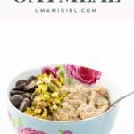 creamy oatmeal with chocolate chips and chopped pistachios in a pretty bowl