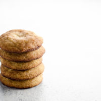 a stack of chewy snickerdoodles on a light background